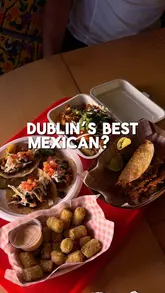A review of La Cocina Cuevas in Naul, Co. Dublin, featuring a variety of Mexican dishes including tacos, a burrito, and loaded tater tots.