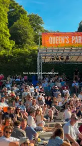 The video showcases an open-air cinema experience at Queen's Park Arena in Glasgow. It features shots of the audience, the venue setup including a disco ball, and food and drink options like pizza and cocktails, highlighting the relaxed and social atmosphere of the event.