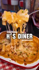 A couple visits an American-themed diner in Eastbourne, showcasing the vibrant decor, food challenges, and a variety of dishes including burgers, tacos, and creative cocktails.