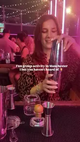 A creator documents their experience at a cocktail masterclass at Boom Battle Bar, featuring tequila-based drink making, sharing platters of bar food, and a game of tequila pong.