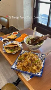 A visual tour of Q Beef Noodles in London, highlighting the kitchen's noodle-making process and a variety of dishes including beef rib noodles, dumplings, and a Chinese burger.