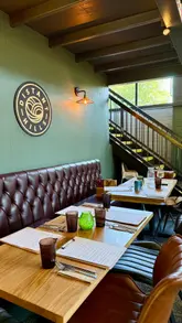 A montage-style video showcasing the atmosphere, food, and drink at Distant Hills Tap & Kitchen. The video features shots of the exterior beer garden, the interior dining area, close-ups of Sunday roasts and desserts, and clips of drinks being prepared.