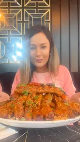 A video showcasing a meal at Alanya restaurant, featuring a variety of Turkish-style dishes including mezze, shrimp, and a large mixed grill platter. The creator is shown enjoying the food, and the video concludes with tea.