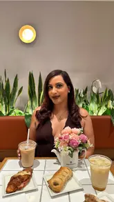 A promotional video for a new Paris Baguette location in Richmond, showcasing a variety of their pastries, cakes, sandwiches, and iced drinks in a bright, inviting cafe setting.