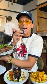 A creator reviews a restaurant called Barnacle, showcasing a large porterhouse steak and explaining how to use the EatClub app to get a significant discount on the bill.