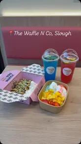 A promotional video for The Waffle N Co in Slough, featuring a montage of waffle preparation, drink mixing, and the venue's interior. The video highlights the aesthetic presentation of the desserts and beverages.
