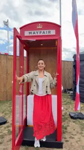A creator visits the Virgin Active 'Dial 1 for Wellness' pop-up booth at BST Hyde Park, demonstrating the interactive experience of connecting with a wellness concierge and receiving a personal training session.