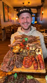 A review of an all-you-can-eat Brazilian steakhouse in Bermondsey, London, highlighting the 'Gold Package' which includes a variety of meats, sides, and cocktails.