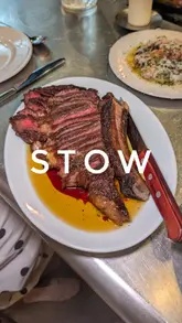 A review of Stow, an open-fire restaurant in Manchester, showcasing various dishes including flatbread, pearl barley, bolognese on toast, cod, ribeye steak, and desserts.