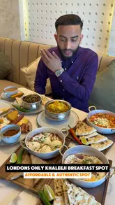 A creator reviews a Khaleeji breakfast and brunch spot in West Ealing, London, highlighting dishes like balaleet, shakshuka, and karak chai. The video features a variety of fresh, authentic Middle Eastern breakfast items served in a cozy setting.