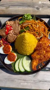 A montage video showcasing various Indonesian dishes and mocktails at Habibie's Kitchen in Bredbury, featuring a traditional Tumpeng platter and other signature items.