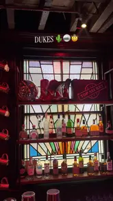 A fast-paced, energetic reel showcasing a group of friends enjoying a night out at a Texas-inspired saloon and karaoke bar called Dukes in Newcastle, featuring cocktails and singing.