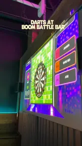 A fast-paced, energetic reel showcasing a visit to Boom Battle Bar, focusing on the interactive darts experience and social drinks.