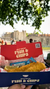 A travel-focused reel documenting a day out in London, starting with a visit to the Tower of London and concluding with a casual lunch of fish and chips by the river.