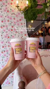 A short, aesthetic reel showcasing a viral, souvenir-style coffee cup from Cream Dream London, featuring the creator holding the cup against various London landmarks.