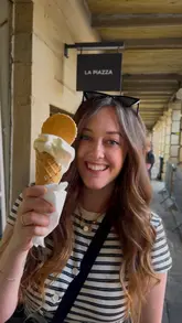 The video is a fast-paced, creator-led tour of The Piece Hall in Halifax, showcasing a variety of independent vendors including a bookshop, a toy and game store, a music shop, a jeweler, and several food and drink spots like The Astronomer Diner and La Piazza. The creator provides a quick, enthusiastic overview of what each vendor offers, making it a helpful guide for visitors.