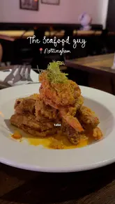 A creator visits 'The Seafood Guy' in Nottingham, a Hong Kong-style cafe, showcasing the interior and various dishes including seafood, french toast, and bao buns.