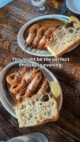 A montage-style review of two venues in Dublin: Fíon Eile, a wine bar, and Borgo, an Italian restaurant. The video features shots of the wine selection, the restaurant exterior, various Italian dishes including prawns, pasta, and desserts, and the interior atmosphere.