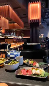 A montage showcasing the interior and various sushi and yakitori dishes at Stick'n'Sushi in Battersea. The video highlights the restaurant's aesthetic and food presentation through a series of clean, well-lit shots.