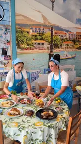 A fast-paced montage showcasing the interior, atmosphere, and various dishes of a Greek and Cypriot restaurant. The video features close-ups of food, drinks, and the venue's decor, set to upbeat music.