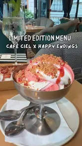 The creator visits Café Ciel at The OWO in London to review their limited-edition collaboration with Happy Endings ice cream. The video features shots of the venue's exterior and interior, various small plates, cocktails, and the featured ice cream dessert, with the creator providing commentary on the experience.