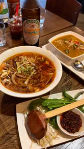 A fast-paced, engaging review of a Vietnamese restaurant in Newcastle, highlighting the interactive nature of the dining experience, including DIY rolls and customizable pho.