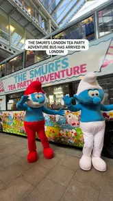 A short video showcasing the Smurfs-themed afternoon tea bus tour in London, featuring views of the city, themed treats, and activities for children.