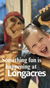 A short, family-oriented video showcasing a child participating in a pottery painting activity and playing in a sandpit area at a garden centre.