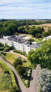A montage showcasing the luxury facilities of Sopwell House, including the hotel grounds, spa, swimming pool, bedroom suites, and dining options.