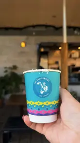 A vlog-style video showcasing a cafe in Bradford, highlighting the decor, menu, and chai preparation.