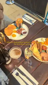 A promotional reel for a bottomless brunch at Slug & Lettuce, featuring two creators enjoying cocktails and brunch food on an outdoor terrace. The video highlights the variety of drinks available and the casual dining atmosphere.