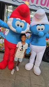 A family-focused vlog documenting a day out in London, featuring a Smurfs-themed afternoon tea bus tour and an interactive trail at the British Museum. The video captures the child's enjoyment of the themed activities, the food served on the bus, and the sightseeing opportunities.