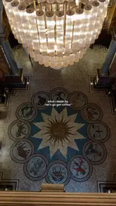 A cinematic, slow-paced tour of the Kimpton Fitzroy London hotel lobby, highlighting its Victorian architecture, mosaic floors, and luxurious seating areas while featuring a coffee and pastry.