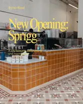 A promotional image for the new Sprigg location on Byres Road, showing the interior counter area. The shot is a straightforward, functional reveal of the new space, highlighting the clean, tiled aesthetic of the service counter.