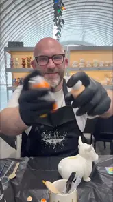 A couple visits a new art studio in Newcastle to try a 'Pour Art' workshop, where they select figures, choose paint colors, and create marbled art pieces.
