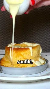 A polished, high-quality food reel featuring a variety of French-inspired dishes and drinks at Brasserie Blanc. The video uses slow-motion close-ups and smooth transitions to highlight the texture and presentation of items like cheese soufflé, steak tartare, duck confit, and desserts, accompanied by text overlays identifying each dish.