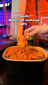 A vlog-style review of Spudz in Wakefield Exchange, showcasing their jacket potatoes and Yorkshire pudding wraps. The creator walks through the venue, highlights the menu, and provides a taste test of the food.