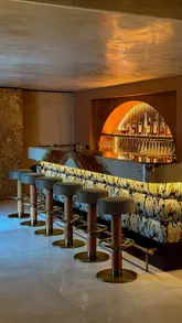 A high-quality, aesthetic montage showcasing the interior, cocktails, and Basque-inspired tapas dishes at Mirari in Cheltenham.