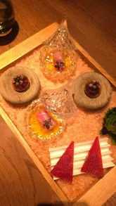 A cinematic reel showcasing an 8-course woodfire-led tasting menu at IGNI in Mayfair. The video features close-up shots of intricate plating, the kitchen team at work, and the counter seating experience.