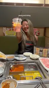 A vlog-style review of Haidilao's new summer menu, featuring the creator trying various hotpot dishes, including a mocktail, soup base, pork, and prawn mince.