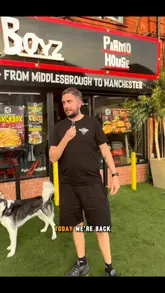 A review of Dough Boyz in Burnage, Manchester, focusing on their signature parmos, including a hot shot parmo and a steak parmo with mac and cheese.