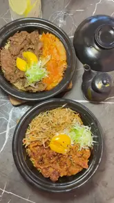 A review of Pot & Rice, a restaurant in London, featuring Taiwanese fried chicken, cheung fun, and various rice pots. The creator highlights the aesthetic pink interior and the quality of the food, while noting a mixed experience with the drinks.