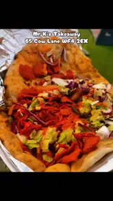 A personal vlog-style review of a local takeaway shop called Mr K's, featuring a visit to the shop, a look at the cooking process, and a review of the pizza and kebab ordered.
