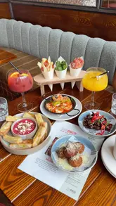 A promotional video for Baresca in Mere Green, Birmingham, featuring a variety of Spanish tapas dishes including garlic prawns, croquettes, and sticky beef, alongside sangria cocktails. The video uses quick, polished cuts to display the food and the restaurant's interior.