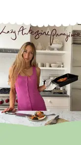 A concise recipe tutorial for a 'Lazy Aubergine Parmigiana', showing the preparation, cooking, and final plating of the dish.