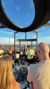 A fast-paced, POV-style video showcasing a cocktail masterclass held inside the glass chimney lift at Battersea Power Station. The video highlights the unique 360-degree views of the London skyline, the interactive nature of the masterclass, and the social atmosphere of the group.