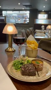 A promotional video for The Cellar restaurant in Cheltenham, showcasing the exterior, the atmospheric interior, the menu, and various dishes including lobster, steak, and dessert.