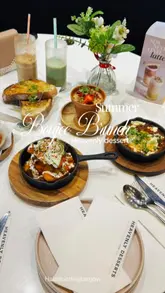 A promotional video showcasing a brunch and dessert visit to Heavenly Desserts, featuring close-ups of savoury dishes like shakshuka and chorizo hash, alongside specialty lattes and dessert pots.
