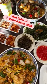 A short, engaging video review of Red Chilli restaurant in Manchester, showcasing their wok-fried noodle dishes, various sides, and drink menu, including homemade teas and cocktails.