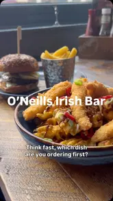 The creator visits O'Neill's to review their new menu, showcasing a variety of pub-style dishes including burgers, waffle fries, gammon, and dessert. The video highlights the venue's casual atmosphere, featuring amenities like a pool table, sports screens, and a photo booth, while noting it is dog-friendly.